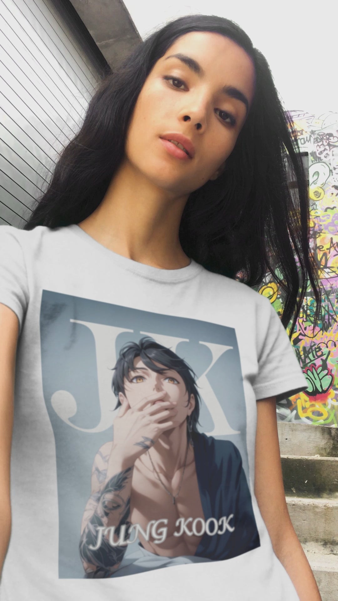 Video showcasing the anime-style unisex T-shirt, featuring Jungkook, blending K-pop stage presence with anime aesthetics. The design captures his intense gaze, flowing hair, and striking composition, creating a fusion of two beloved art forms. Printed on soft, breathable Airlume cotton for comfort and style. ModeK Vetements.