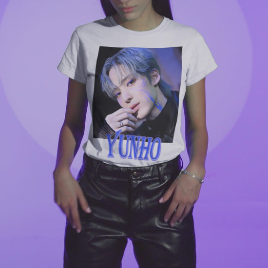 Video showcasing the Yunho ATEEZ graphic t-shirt in white, featuring a blue cyberpunk portrait with glowing circuit-like lines across his cheekbones, matching blue eyelids, silver ring, and transparent sleeve. Styled with cool-toned hair and a futuristic atmosphere. From ModeKVetements.