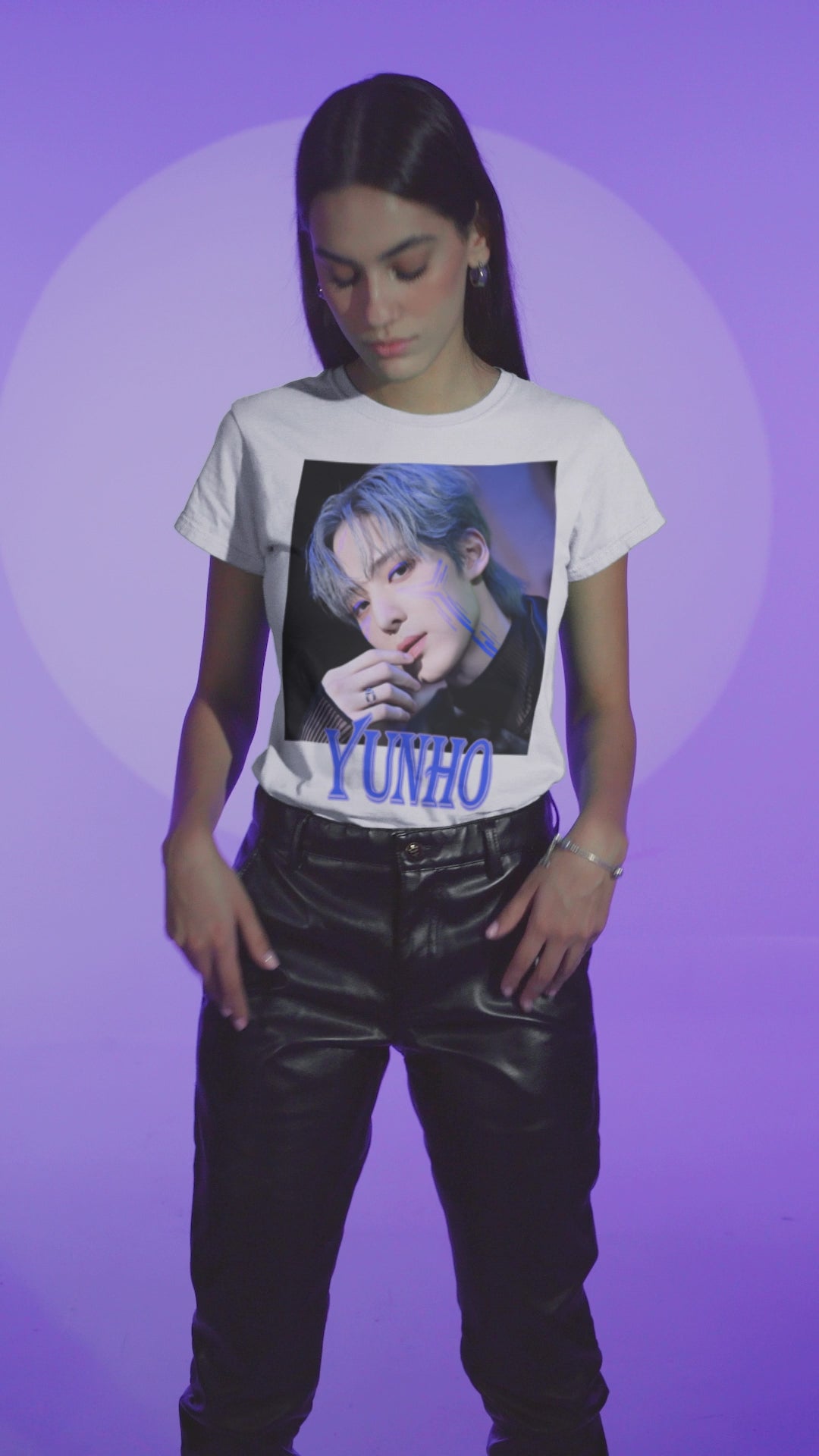 Video showcasing the Yunho ATEEZ graphic t-shirt in white, featuring a blue cyberpunk portrait with glowing circuit-like lines across his cheekbones, matching blue eyelids, silver ring, and transparent sleeve. Styled with cool-toned hair and a futuristic atmosphere. From ModeKVetements.