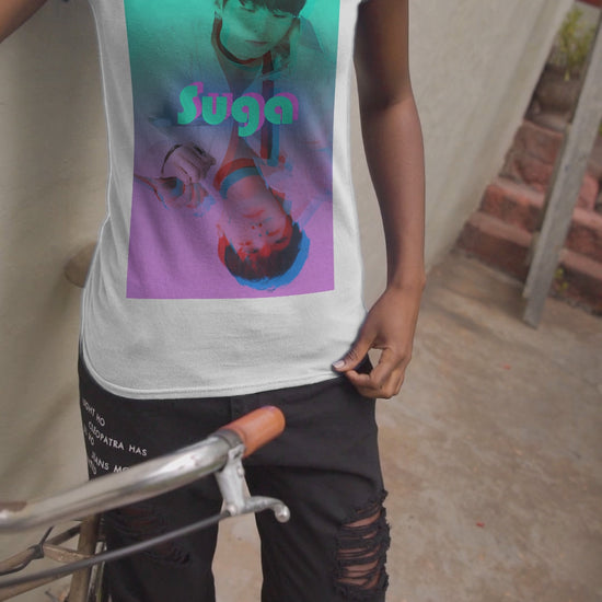 Video showcasing a Unisex cotton T-shirt in white, featuring Suga of BTS (Agust D) in cyan, looking into a mirror. His lavender reflection appears glitched, starting at his right hand. The surreal gradient and distortion suggest a drifting, dreamlike moment out of sync with reality. From ModeK Vetements.