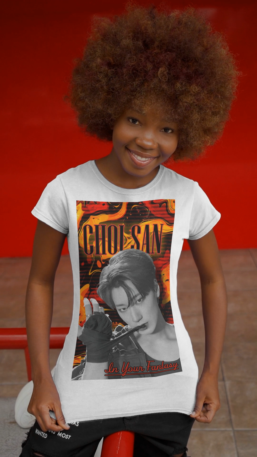 Video showcasing the Unisex airlume cotton t-shirt in white, featuring a Monochrome portrait of Choi San of ATEEZ biting a wrap, surrounded by glitch effects and a swirling Fire Engine Red and Gold Drop background. Red glowing text adds heat to the surreal, seductive atmosphere. From ModeK Vetements.