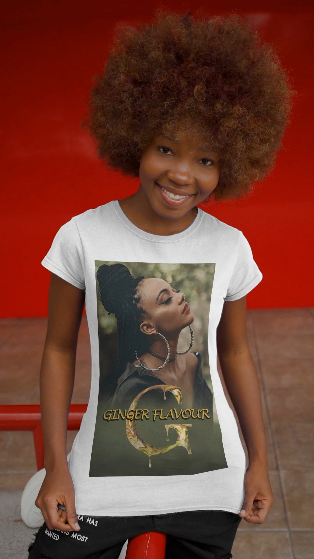 Video showcasing the Ginger Flavour unisex cotton t-shirt in white, featuring a centered design of a woman with eyes closed, moon-shaped earrings, and soft mist. Printed on 100% US cotton, ethically made and Oeko-Tex certified. ModeK Vetements.