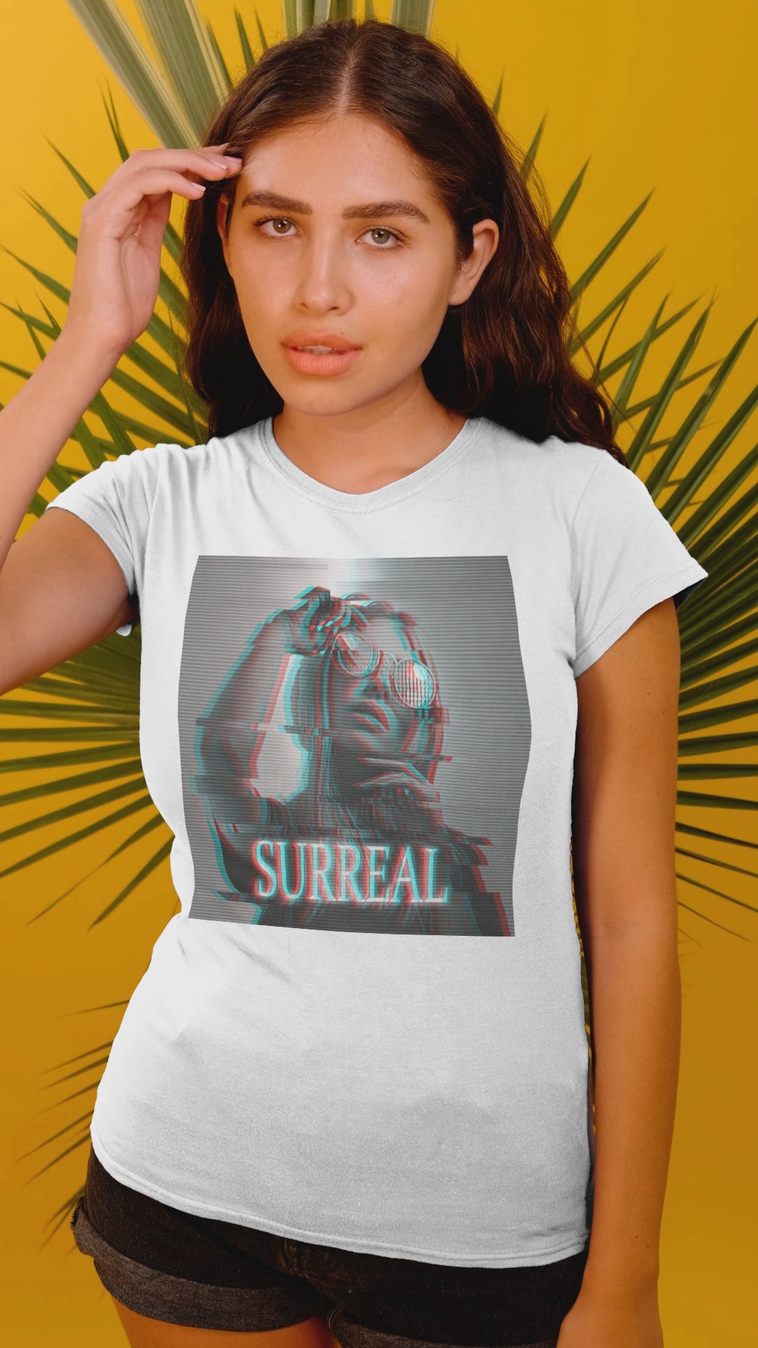 Video showcasing the Surreal unisex T-shirt in white, with red-cyan anaglyph and scan line effects, featuring a woman's soft, glitched silhouette — an illusion caught between memory and reality. From ModeK Vetements.