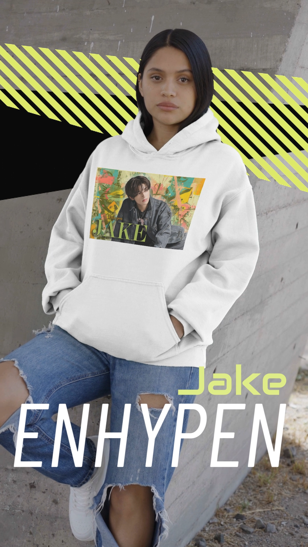 Video showcasing the Unisex 100% Cotton Hoodie in white, featuring Jake of ENHYPEN framed in a layered pastel graffiti-style background, with calm expression and denim styling, surrounded by scanline textures. From ModeK Vetements.