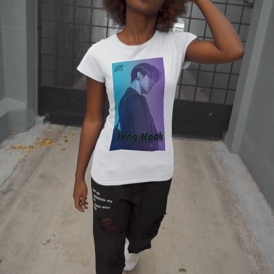 Video showcasing the Jung Kook BTS Unisex T-shirt in white, featuring a cyan-to-lavender gradient, vinyl-inspired circular background, retro lettering, and profile portrait with suit and leather bag – cinematic unisex style. 100% Airlume combed and ringspun cotton. ModeK Vetements.
