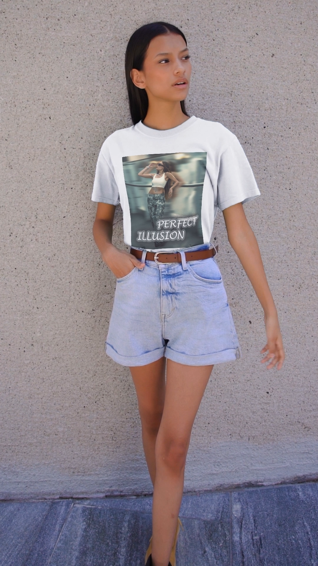 Video featuring a model wearing a unisex 100% ring-spun cotton t-shirt in white with a graphic design: a woman in tactical camo cargo pants and a white crop top stands as a sharp anchor against a blurry, cinematic urban background. The design also features a digital dispersion effect and electric blue rays, symbolizing the "Perfect Illusion" where brute force hides a deeper reality of tenderness and beauty. From ModeK Vetements.