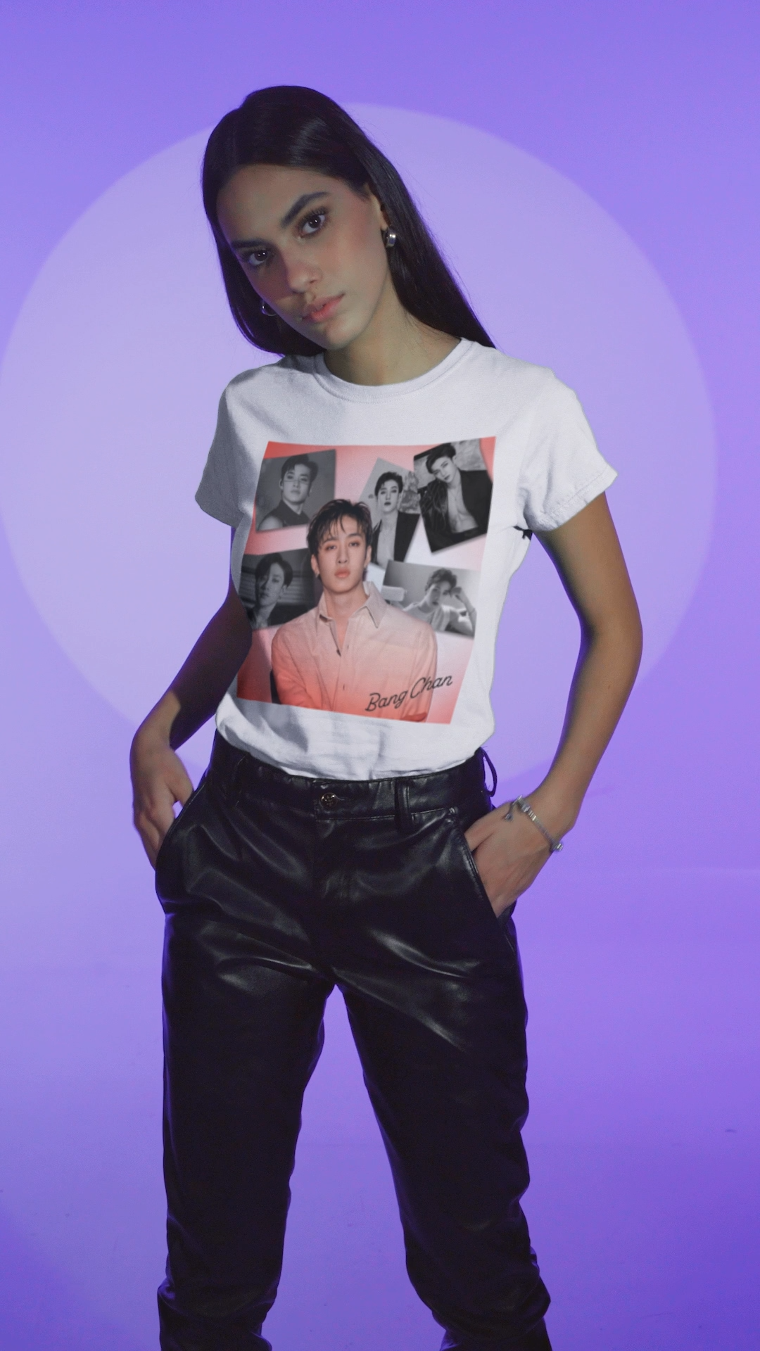 Video showcasing the Bang Chan Stray Kids Unisex T-Shirt in white, featuring a soft pink glow and black-and-white portraits. A design capturing his warmth, quiet confidence, and magnetic presence. 100% ring-spun cotton from ModeK Vetements.