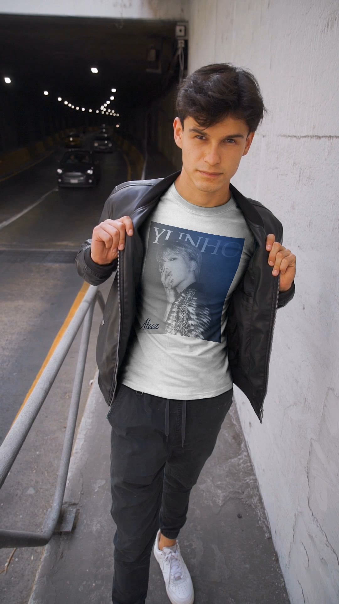 Video showcasing Yunho from ATEEZ printed on a unisex t-shirt in white, wearing a dramatic metallic epaulette of scales and stones with 3D metallic nail art. A cobalt-to-iron gradient and bold lettering complete the retro aesthetic. From ModeK Vetements.