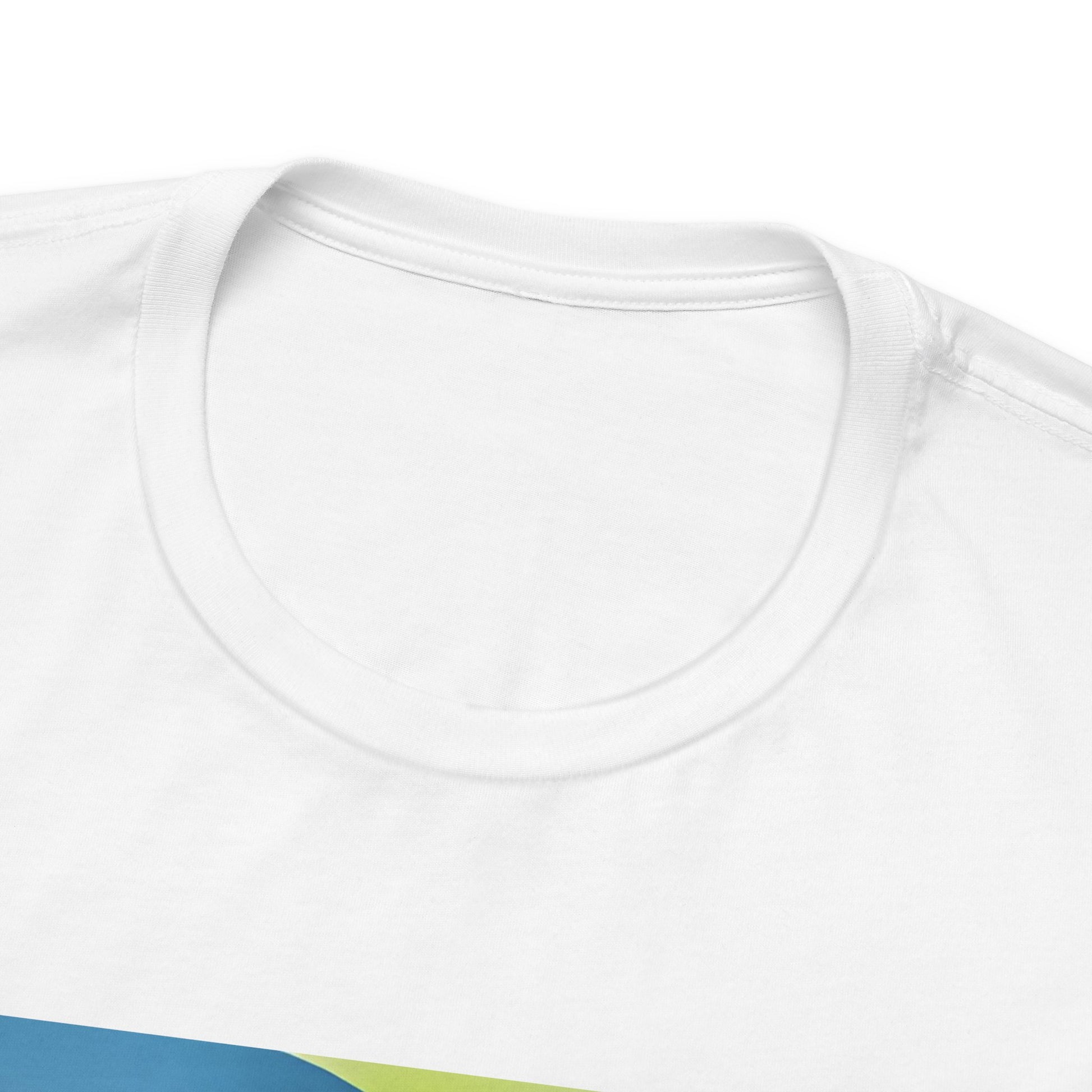 Closeup on the neckline of the unisex jersey T-Shirt in white featuring a woman sitting on a sunlit rocky beach with mint text “WHAT I’M FEELING.” A folded corner reveals a rusty-tipped page butterfly. — From ModeK Vetements.