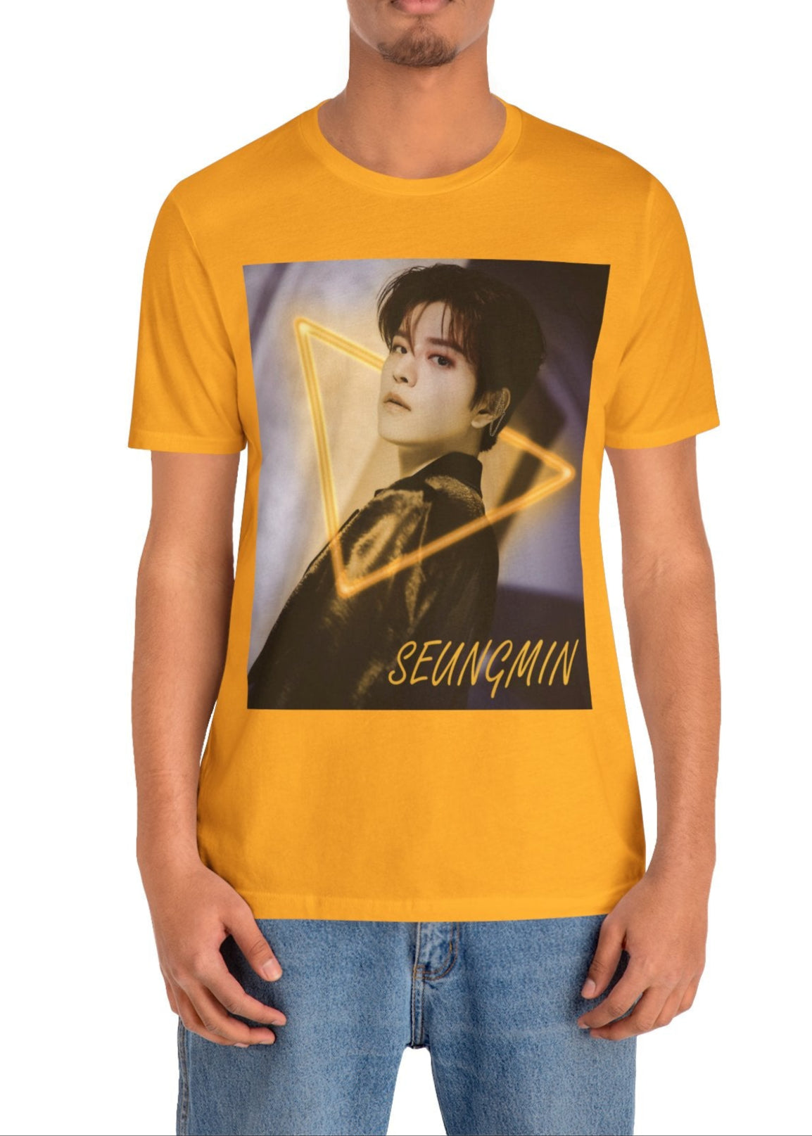 Seungmin Stray Kids Unisex T-Shirt in gold – K-pop fan merch with a neon triangle design. His intense gaze invites mystery and style on soft Airlume cotton. ModeK Vetements.