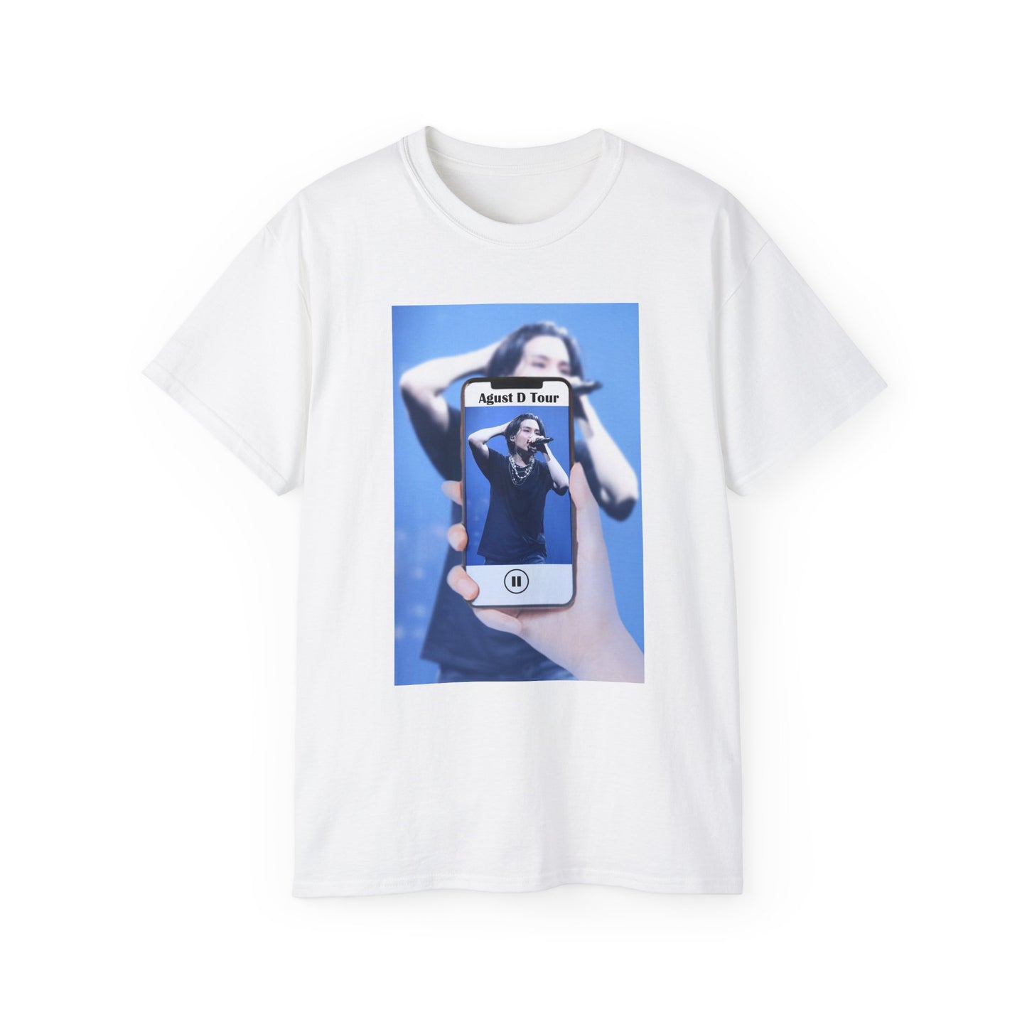 Draped unisex T-shirt in white, featuring BTS’s SUGA mid-performance during the Agust D Tour, shown through a phone screen with a video player overlay. The foreground is sharp and vivid, while the background is softly blurred. ModeK Vetements. 