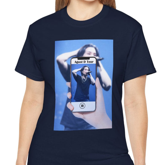 Unisex T-shirt in navy, featuring BTS’s SUGA mid-performance during the Agust D Tour, shown through a phone screen with a video player overlay. The foreground is sharp and vivid, while the background is softly blurred. ModeK Vetements. 