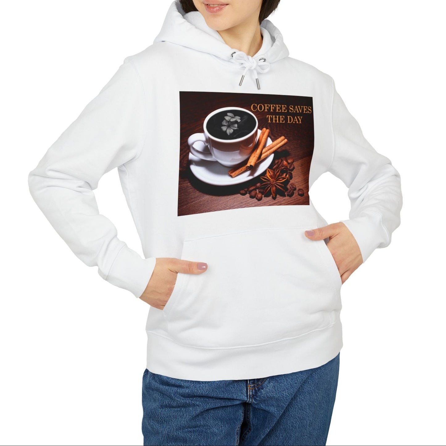Unisex hoodie in white, with front graphic showing a white porcelain coffee cup surrounded by cinnamon sticks, star anise, and coffee beans, with a dark foam surface blooming into a subtle flower shape. 100% organic, combed and ring-spun cotton from ModeK Vetements.