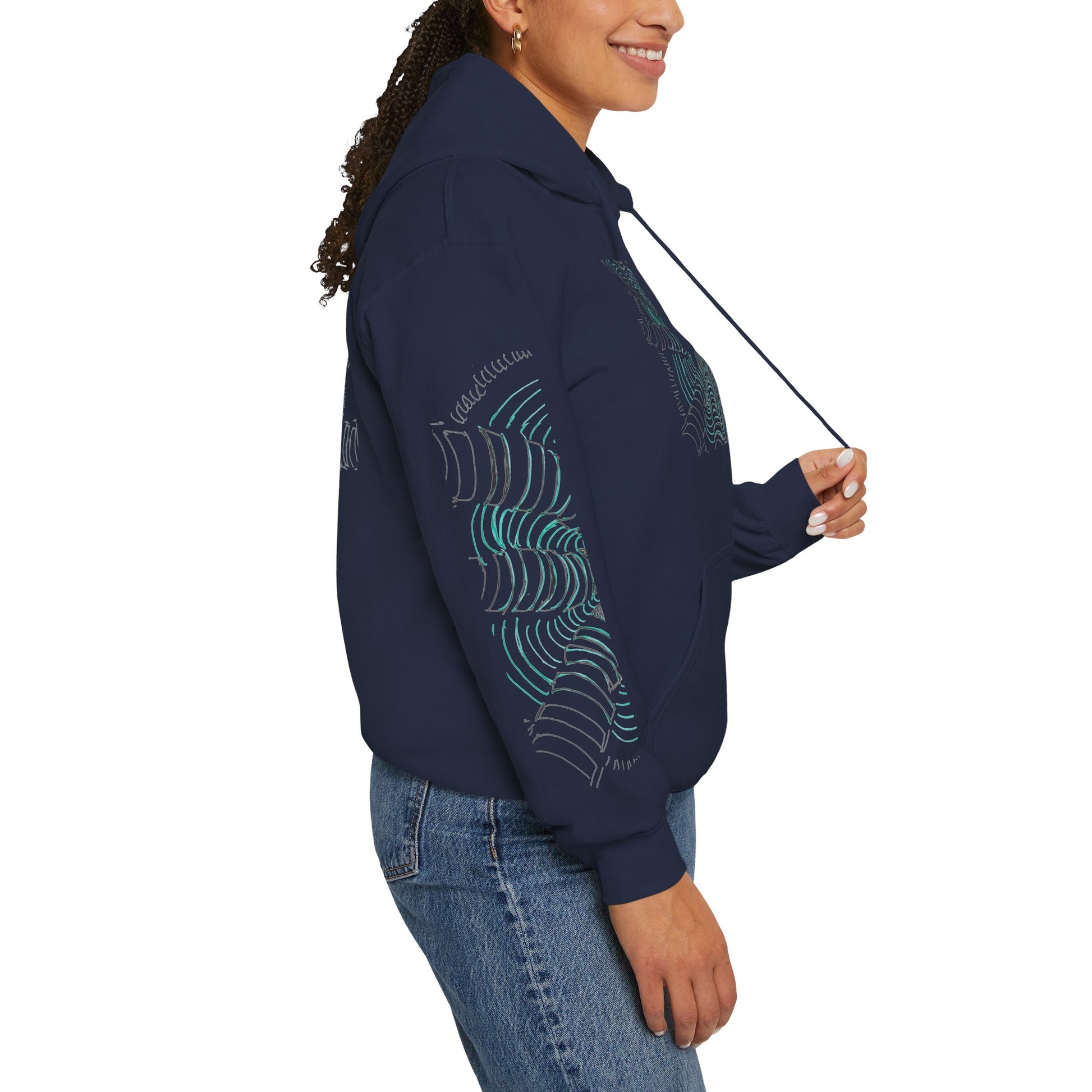 Right sleeve of the unisex heavy blend hoodie in navy featuring a hand-drawn psychedelic zentangle artwork. Eight segmented white pillars radiate outward from a complex center, surrounded by concentric electric teal ripples that curve inward to create a powerful 3D tunnel effect and optical illusion of movement. From ModeK Vetements.