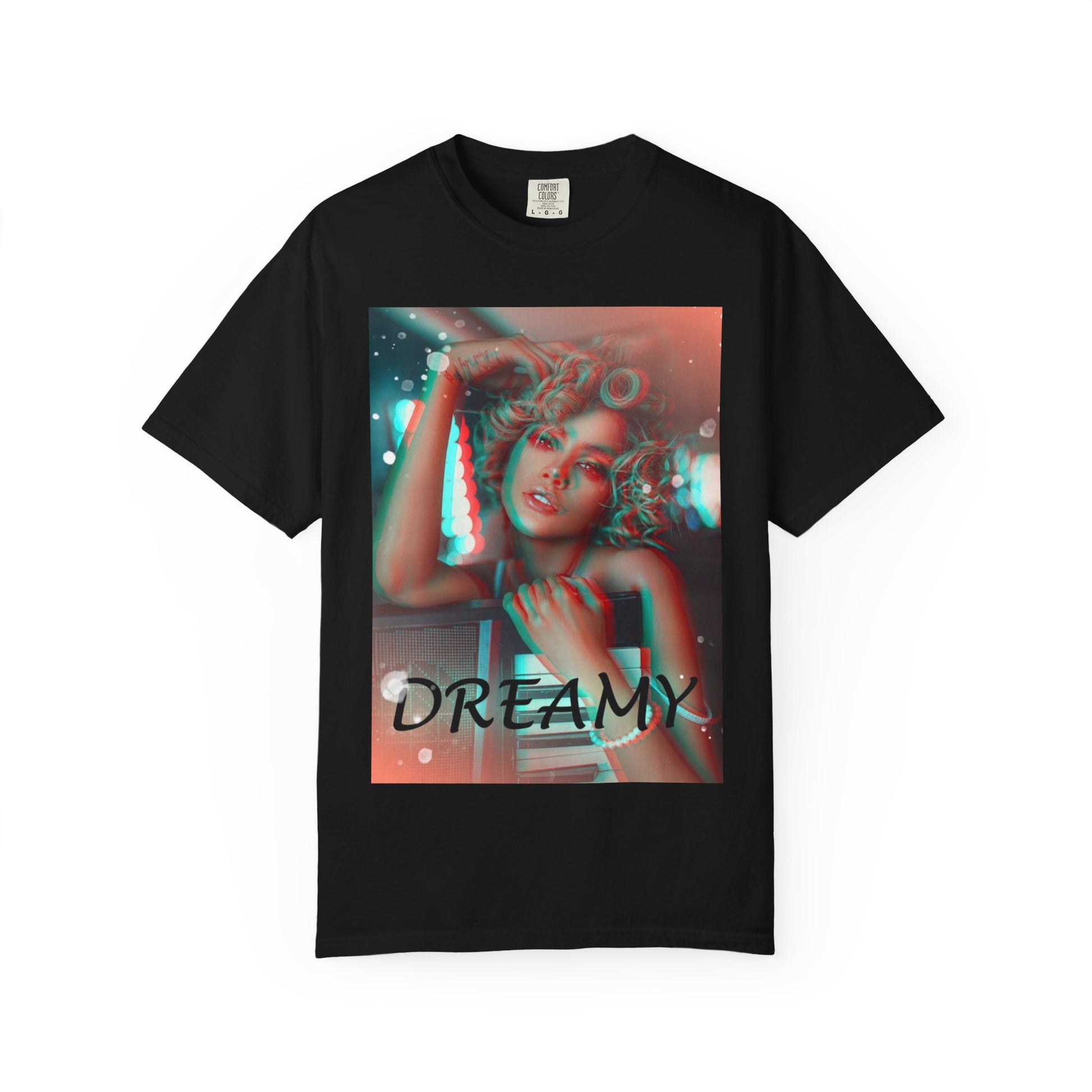 Draping unisex 100% ring-spun cotton T-Shirt in black featuring a DTG graphic design: a stylized anaglyph portrait of a woman with curly hair, leaning on an electronic keyboard. The design uses a 3D glitch effect with shifting layers of electric blue and bittersweet red-orange, capturing a "DREAMY" cinematic atmosphere. From ModeK Vetements.