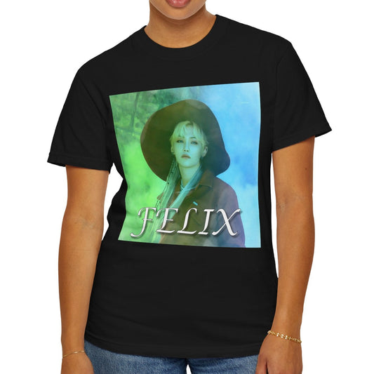 Unisex 100% ring-spun cotton T-Shirt in black, featuring a portrait of Stray Kids' Felix wearing a large hat. It is as if he was painted on canvas with the effect of a mist, blending soft light blue and light green tones. From ModeK Vetements.