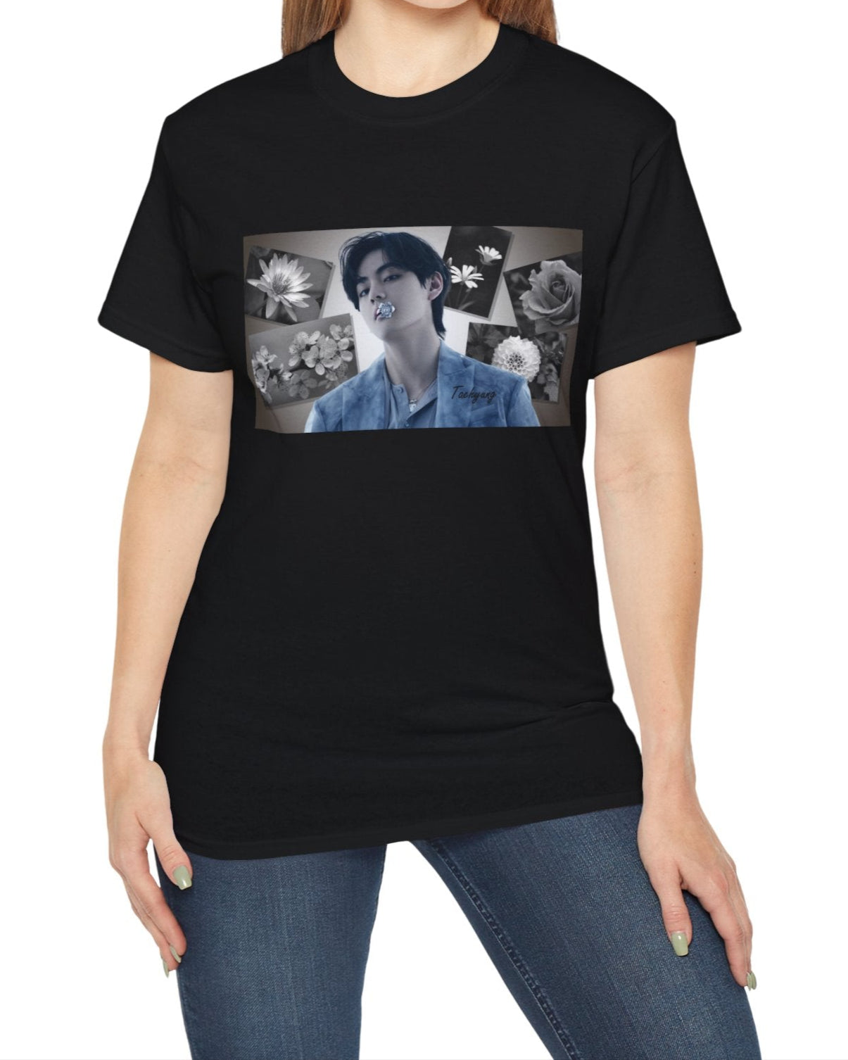 Unisex cotton T-shirt in black, featuring a portrait of BTS’s Taehyung (V) holding a blue flower in his mouth, surrounded by grayscale images of a rose, sakura, water lily, dahlia, and rabelera in a collage-style background. ModeK Vetements.