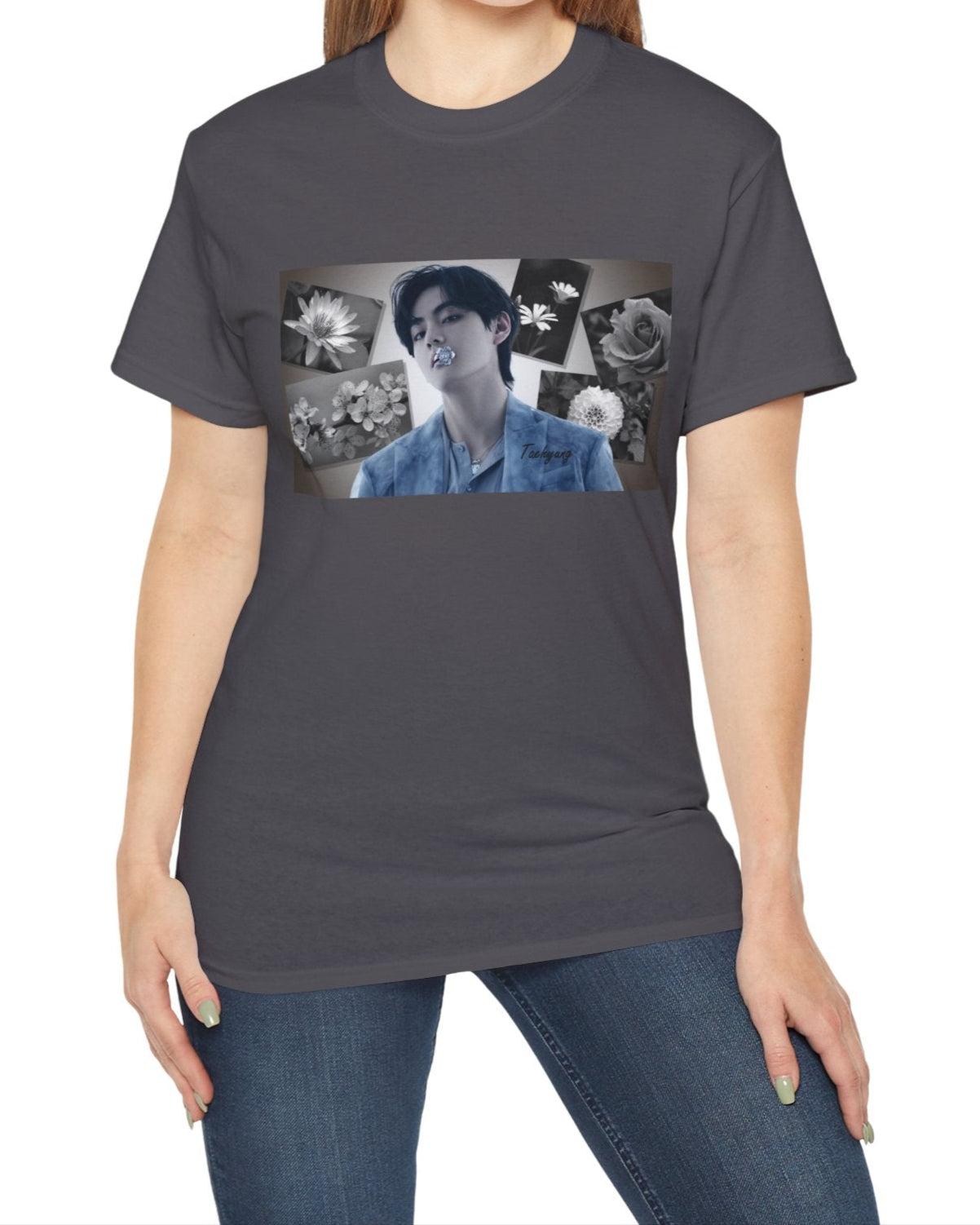 Unisex cotton T-shirt in charcoal, featuring a portrait of BTS’s Taehyung (V) holding a blue flower in his mouth, surrounded by grayscale images of a rose, sakura, water lily, dahlia, and rabelera in a collage-style background. ModeK Vetements.