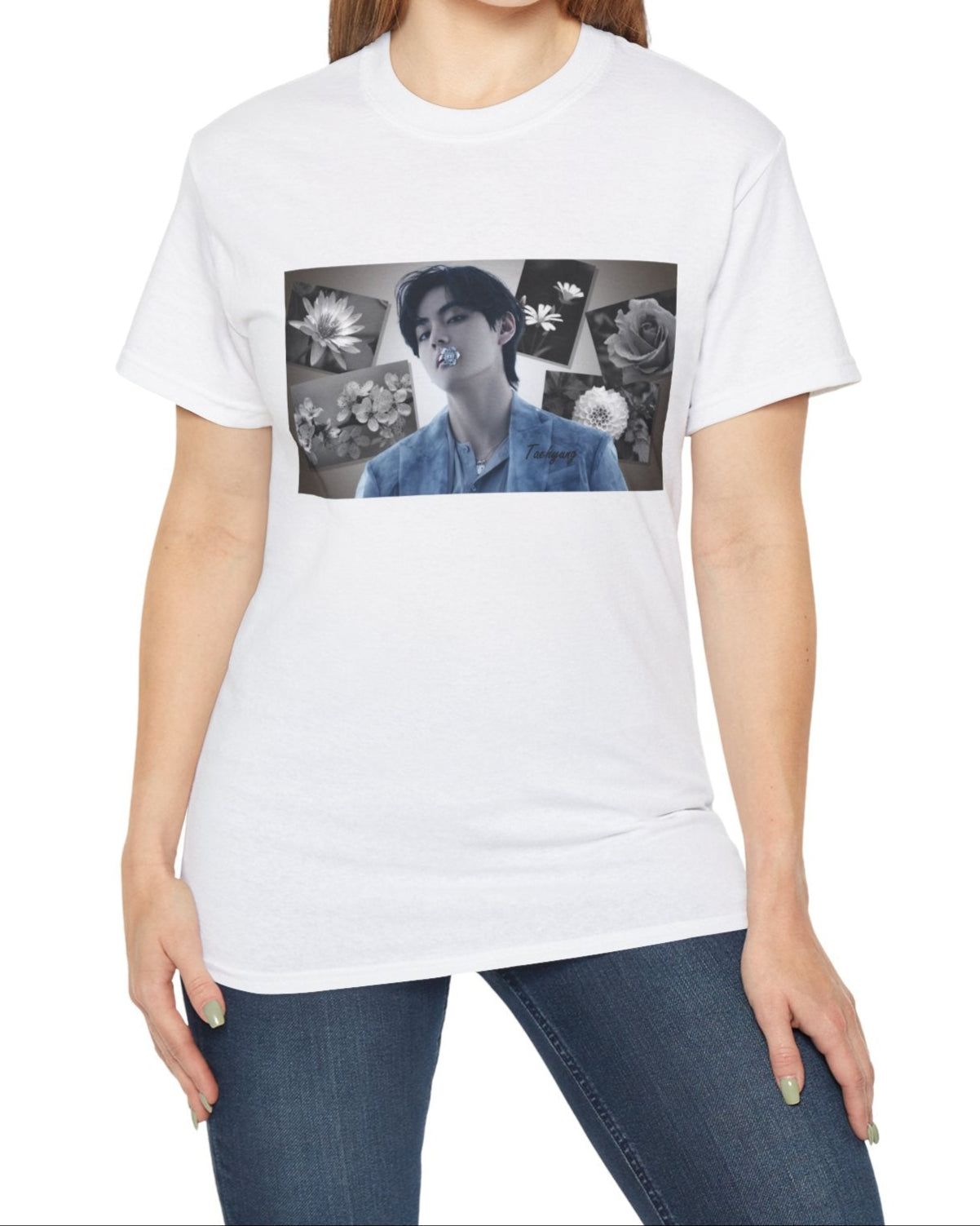 Unisex cotton T-shirt in white, featuring a portrait of BTS’s Taehyung (V) holding a blue flower in his mouth, surrounded by grayscale images of a rose, sakura, water lily, dahlia, and rabelera in a collage-style background. ModeK Vetements.