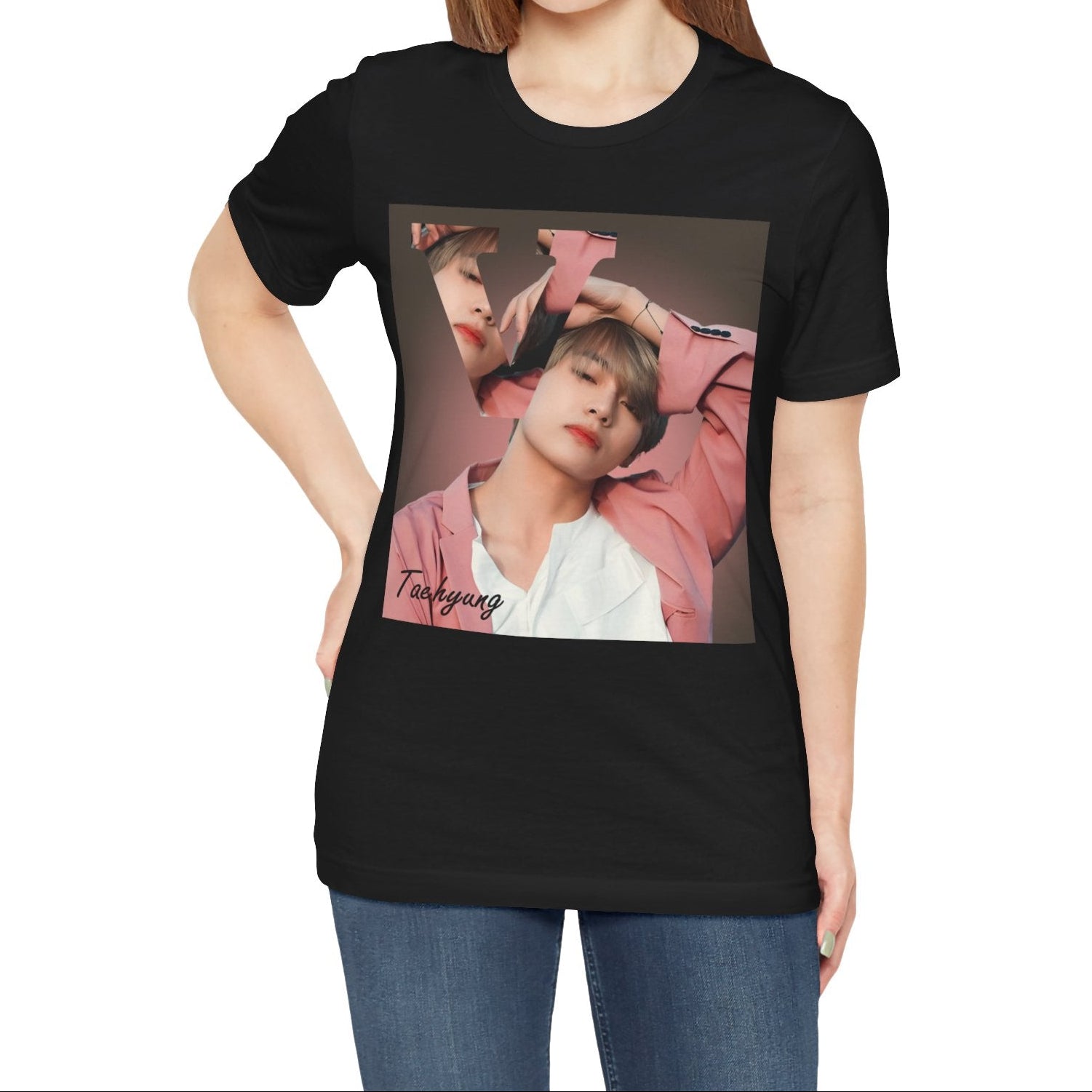 Female model showcasing the V BTS Unisex T-Shirt in black – A seamlessly blended design capturing V’s unpredictable, dreamy essence. Aesthetic pink tones enhance his depth and artistic allure. 100% Airlume conbed and ring-spun cotton from ModeK Vetements.
