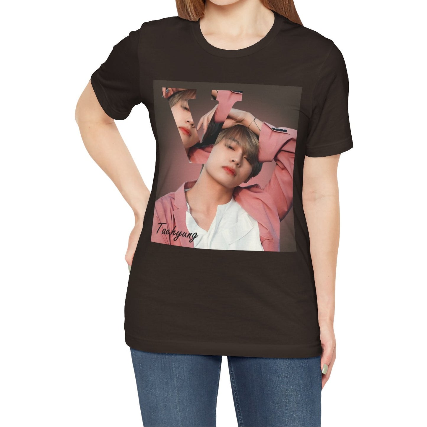 Female model showcasing the V BTS Unisex T-Shirt in brown – A seamlessly blended design capturing V’s unpredictable, dreamy essence. Aesthetic pink tones enhance his depth and artistic allure. 100% Airlume conbed and ring-spun cotton from ModeK Vetements.