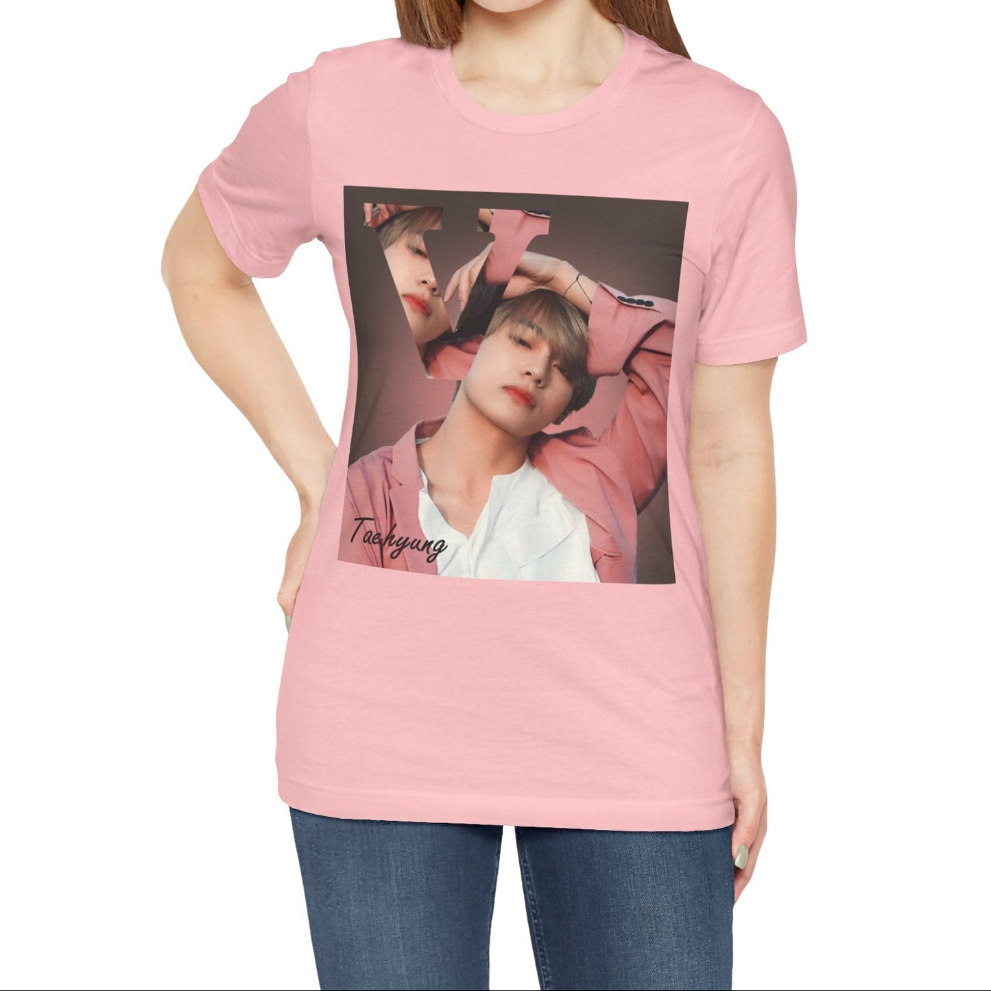 Female model showcasing the V BTS Unisex T-Shirt in pink – A seamlessly blended design capturing V’s unpredictable, dreamy essence. Aesthetic pink tones enhance his depth and artistic allure. 100% Airlume conbed and ring-spun cotton from ModeK Vetements.