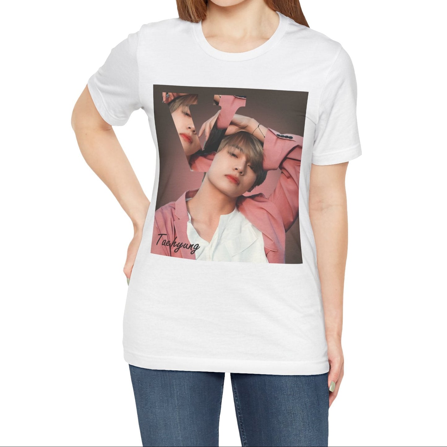 Female model showcasing the V BTS Unisex T-Shirt in white – A seamlessly blended design capturing V’s unpredictable, dreamy essence. Aesthetic pink tones enhance his depth and artistic allure. 100% Airlume conbed and ring-spun cotton from ModeK Vetements.