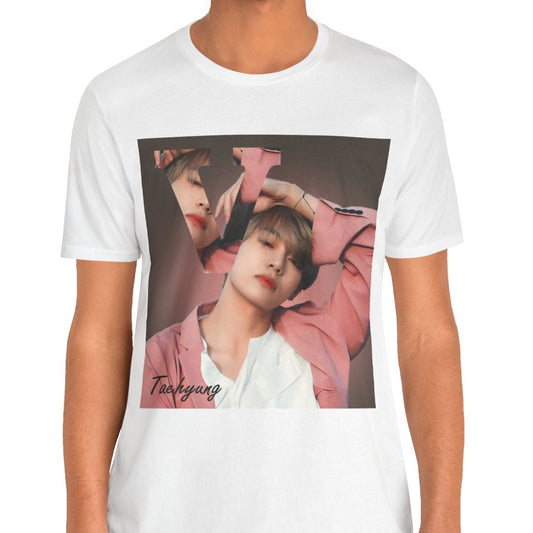 Male model showcasing the V BTS Unisex T-Shirt in white – A seamlessly blended design capturing V’s unpredictable, dreamy essence. Aesthetic pink tones enhance his depth and artistic allure. 100% Airlume conbed and ring-spun cotton from ModeK Vetements.