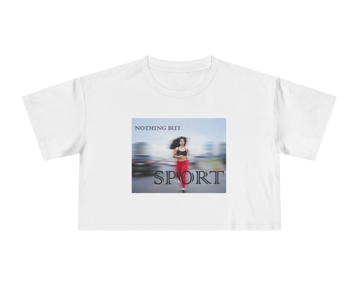 Flat laying women’s crop t-shirt in white from midweight 100% combed cotton with a relaxed fit. Features a centered design of a runner in motion against a blurry background and the text “NOTHING BUT SPORT.” — From ModeK Vetements.