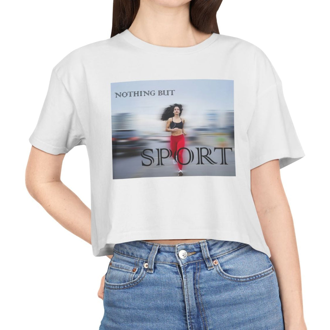 Women’s crop t-shirt in white from midweight 100% combed cotton with a relaxed fit. Features a centered design of a runner in motion against a blurry background and the text “NOTHING BUT SPORT.” — From ModeK Vetements.