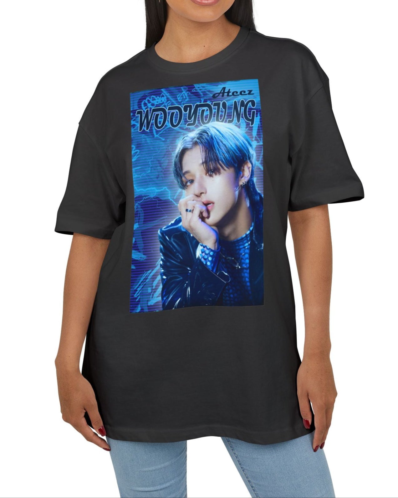Unisex oversized cotton T-shirt in black, featuring Wooyoung of ATEEZ in a graffiti-style design with electric blue tones, glowing silhouette, race car font, and purple scan lines. From ModeK Vetements.