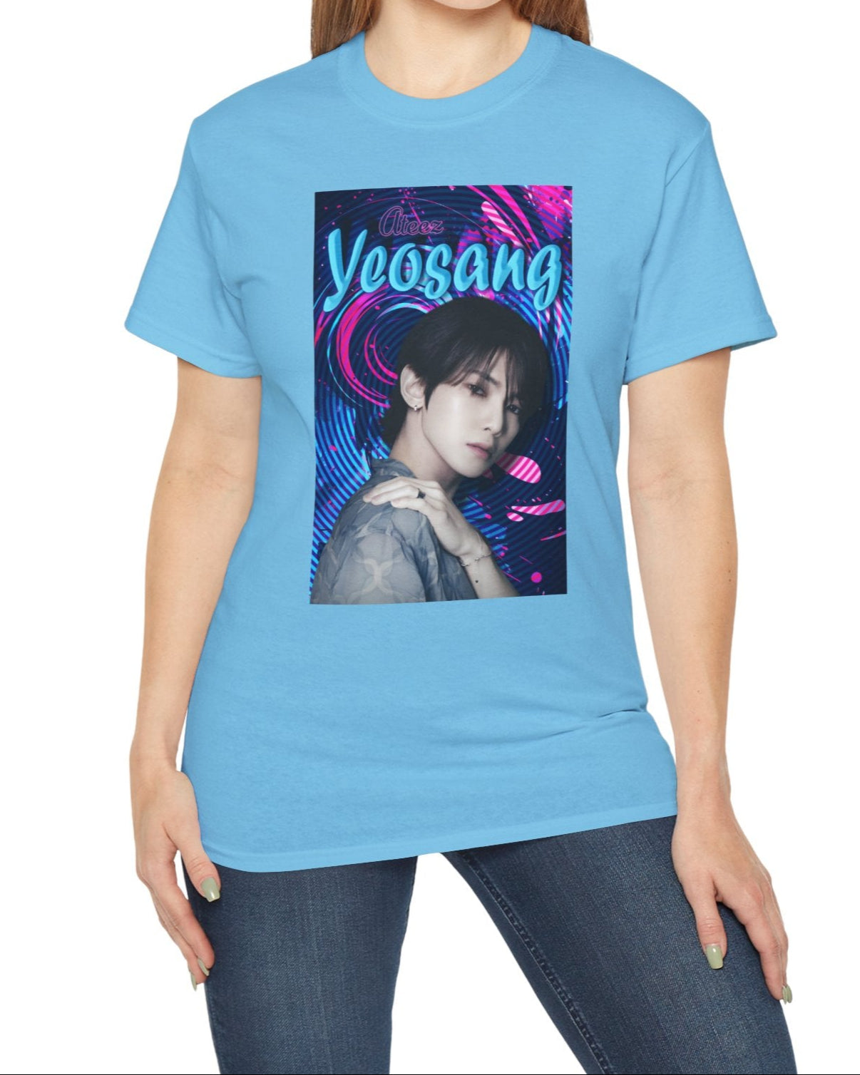 Portrait of Yeosang of ATEEZ surrounded by concentric digital lines and flowing paint-like textures. The design blends graffiti-inspired lettering with koi-like motion in blue lagoon and pink hues, printed on a unisex cotton t-shirt in sky. From ModeK Vetements.
