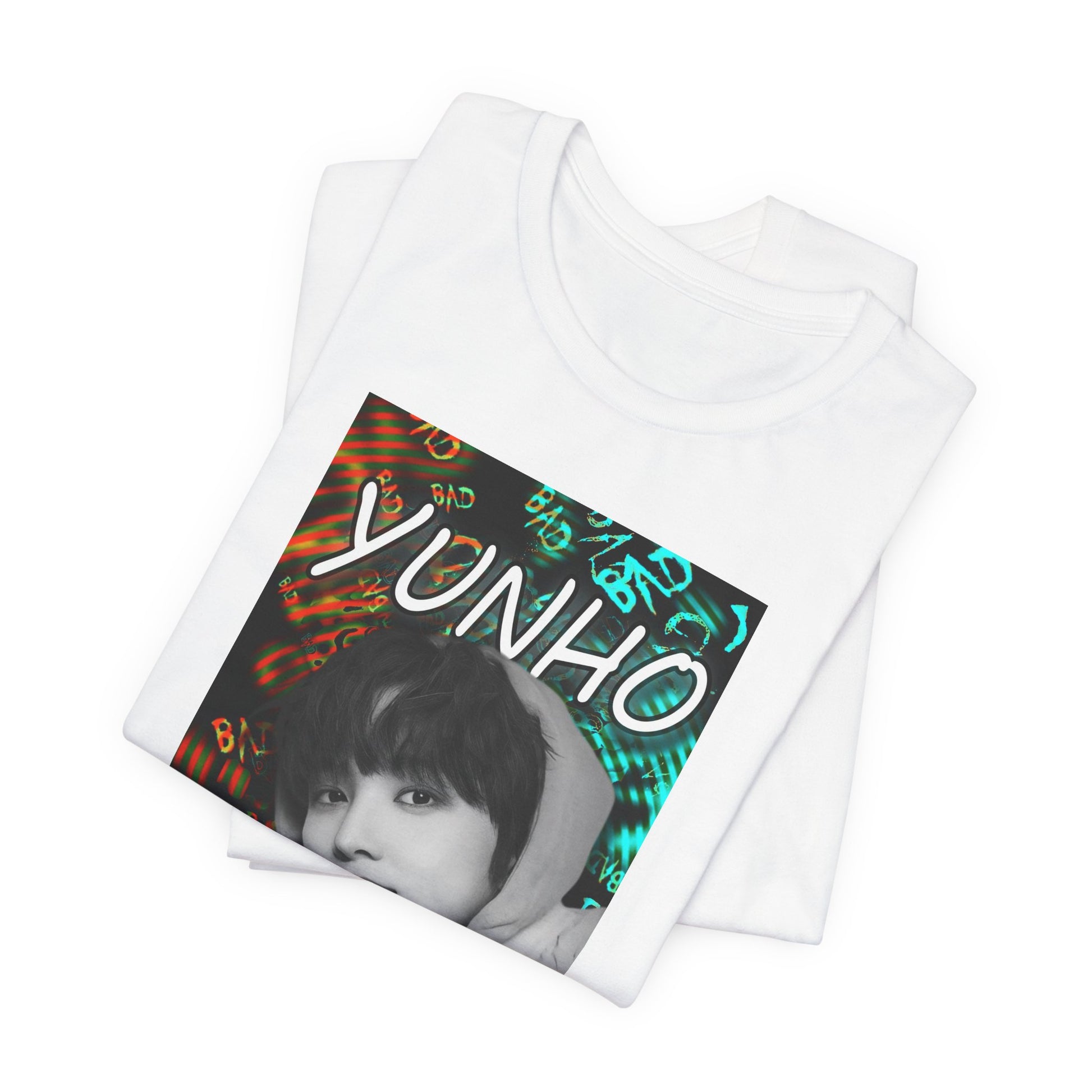 Folded Unisex airlume combed & ring-spun cotton t-shirt in white, featuring Yunho of ATEEZ in monochrome, biting a drawcord, as glitchy concentric ripples pulse around him. Ferrari red melts into aqua and green — a tempest of color and emotion, suspended mid-thought. From ModeKVetements.