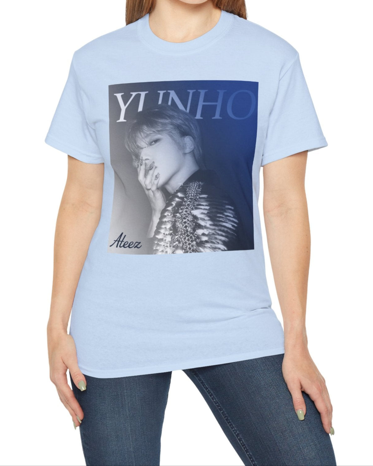 Yunho from ATEEZ printed on a unisex t-shirt in light blue, wearing a dramatic metallic epaulette of scales and stones with 3D metallic nail art. A cobalt-to-iron gradient and bold lettering complete the retro aesthetic. From ModeK Vetements.